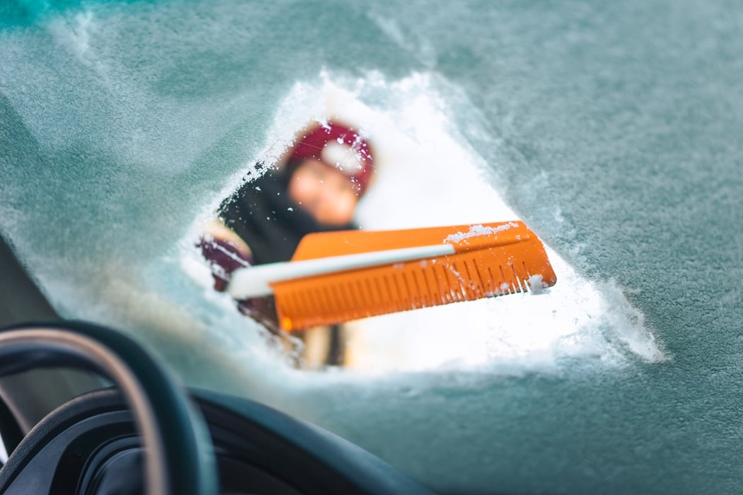 Washing off salt residue from car after snowy conditions in New Jersey